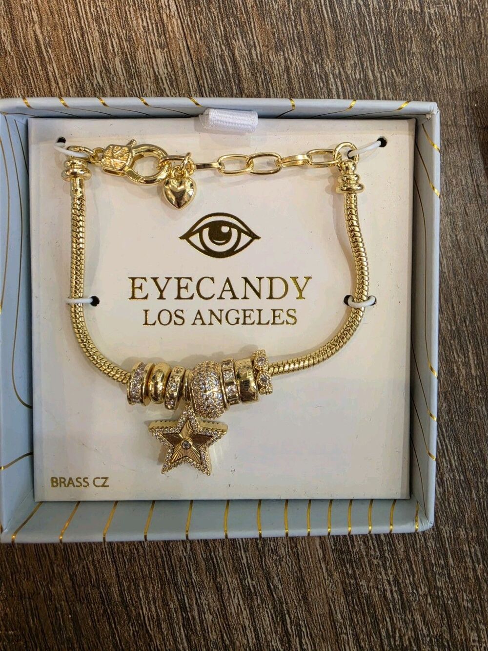 EYECANDY LOS ANGELES Gold Tone Snake Chain Bracelet with Star Dangle Charm, CZ